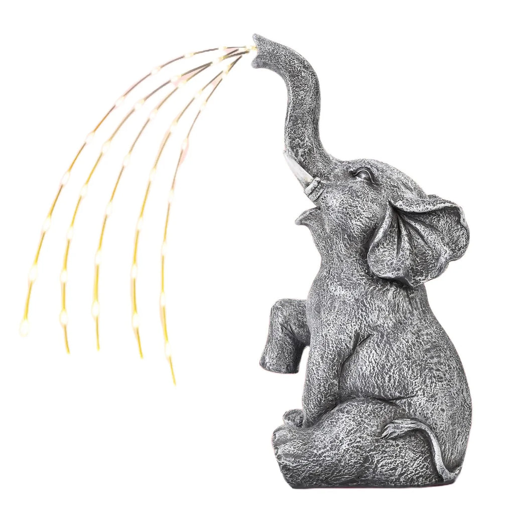 Grey resin elephant garden sculpture with solar panel and LED lights for outdoor decoration.