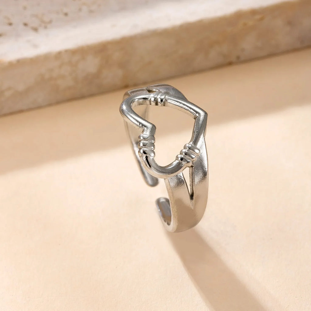 Stainless steel open ring with hollow star and moon design, electroplating finish, unisex average size.