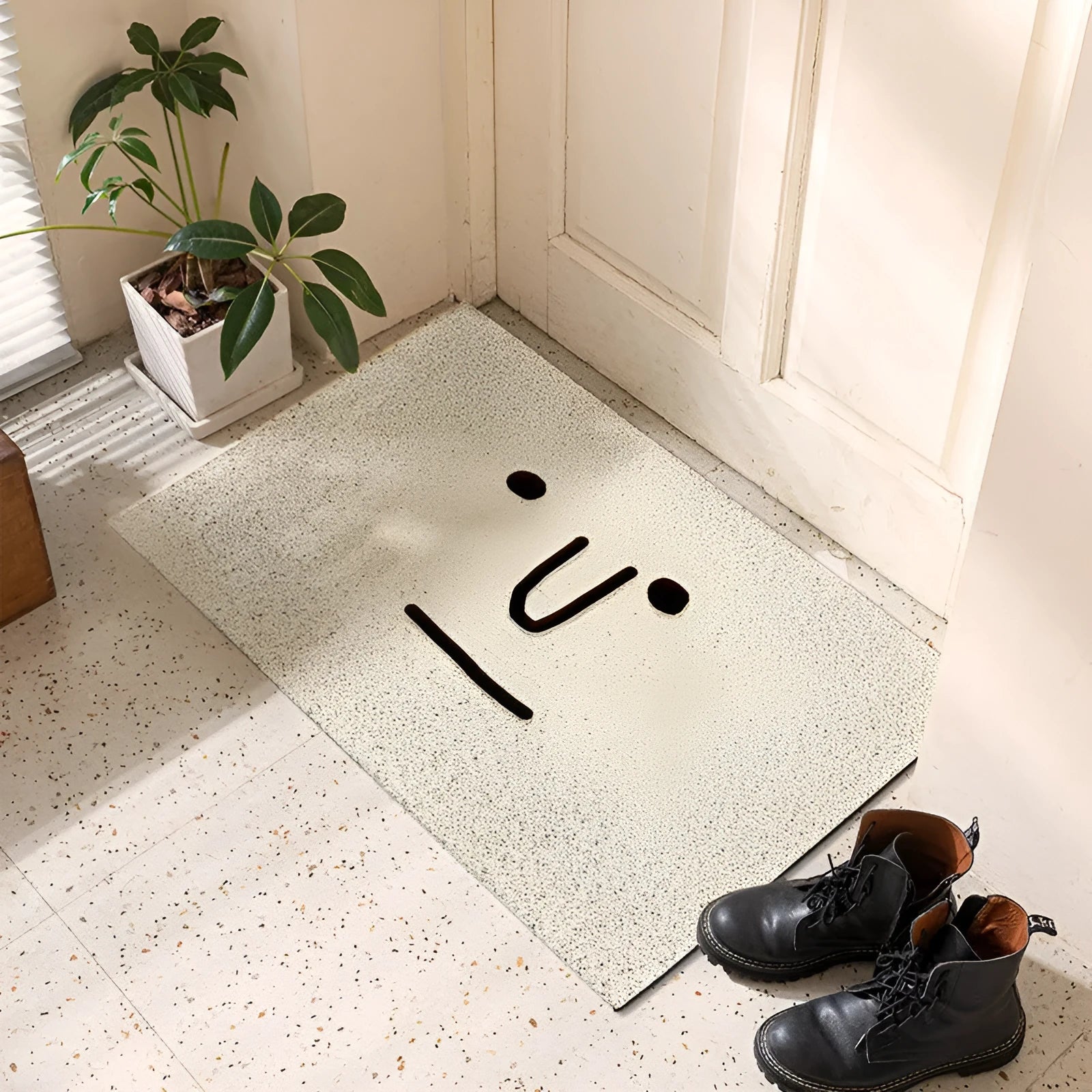 Square PVC floor mat with a geometric cartoon face Mr. Big Nose pattern in multiple size options.