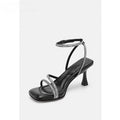 Women's silver rhinestone ankle-strap sandals with a square toe and buckle fastening.