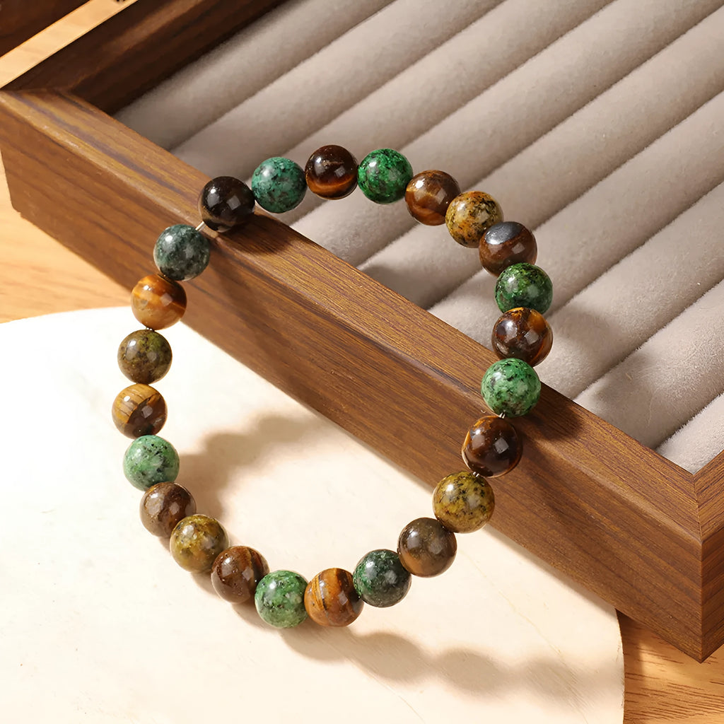 Handmade Tigereye stone fortune bracelet with antique style floral carving measuring 18mm