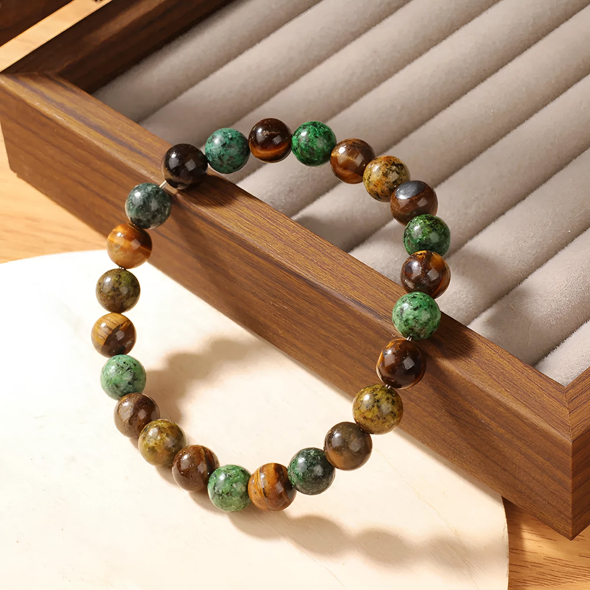 Handmade Tigereye stone fortune bracelet with antique style floral carving measuring 18mm