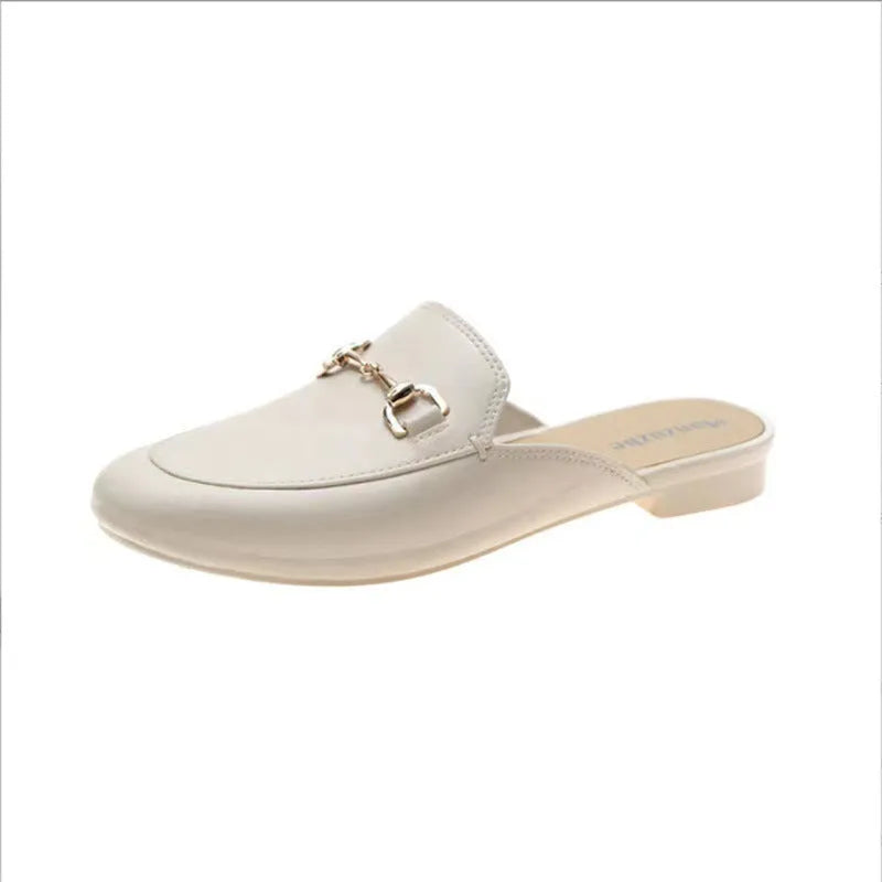 Women's PVC closed-toe half slippers with metal buckle in choice of colours.
