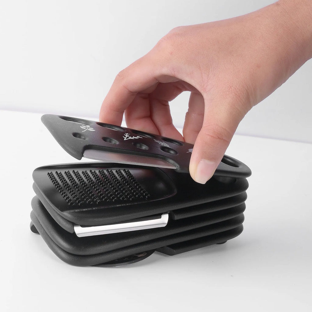 Six kitchen gadget widgets and a brush in a colour box, made from PP and stainless steel.