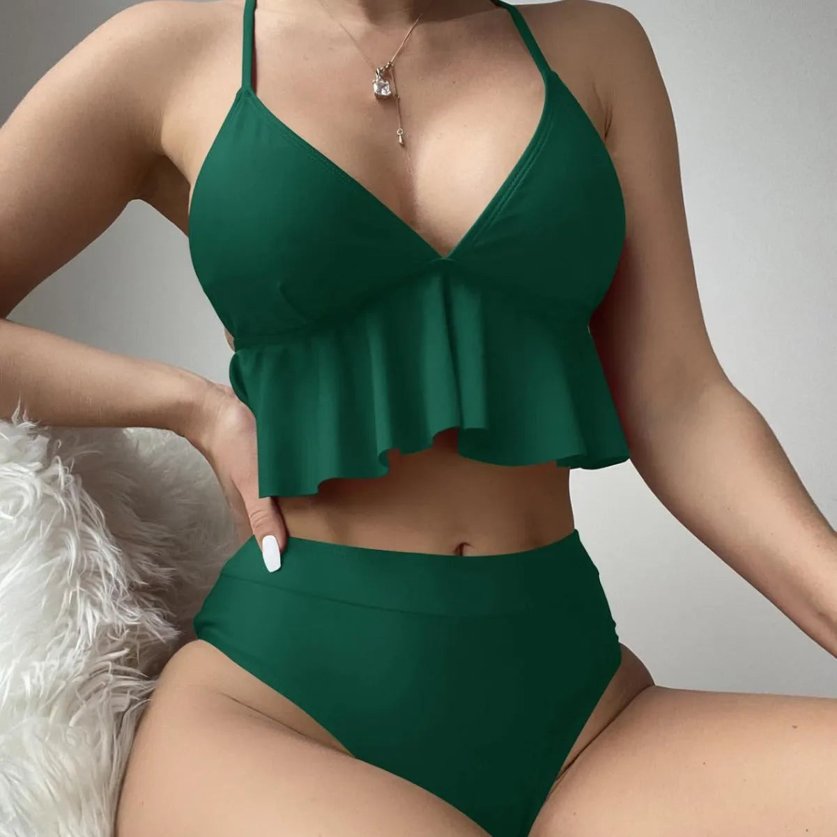 Women's solid colour split bikini swimsuit on a white background