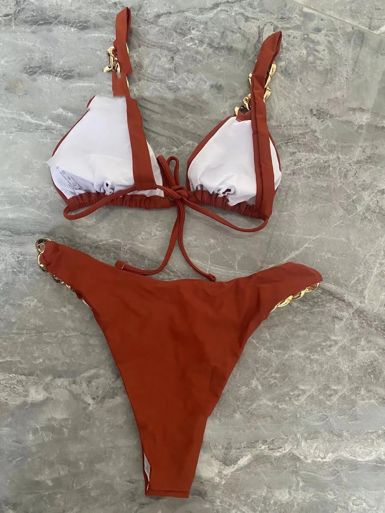 Brown women's tube-top push-up bikini swimsuit with ring tether details.