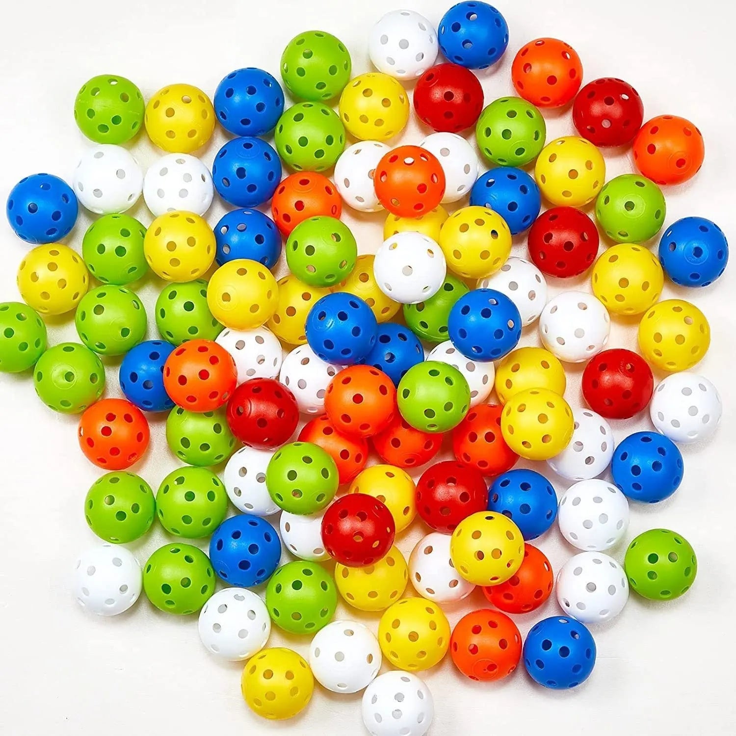 Multi-colour golf practice balls with a 26-hole target mat, stored in a net pocket.