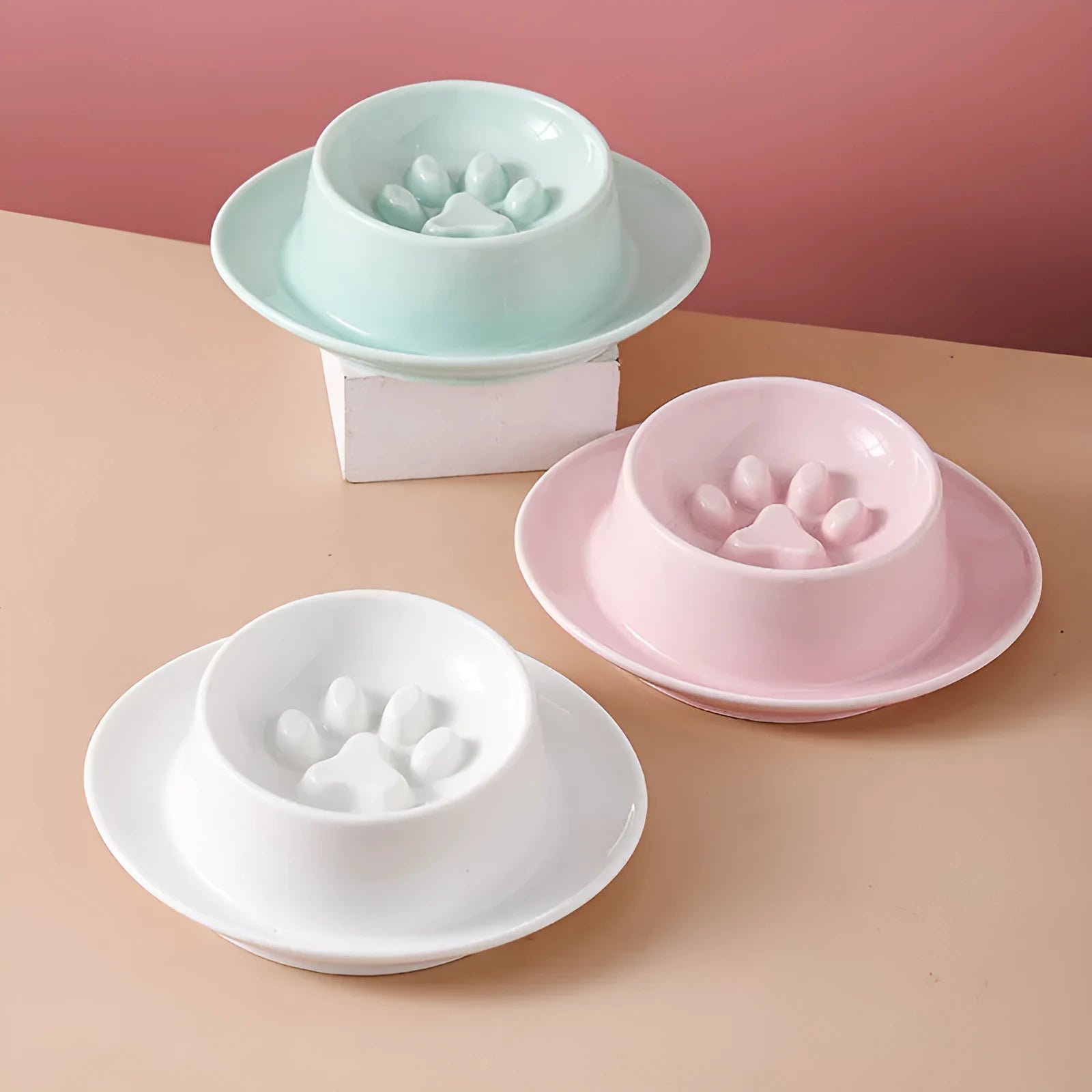 Green ceramic slow feed pet bowl with a central mound and obstacles to prevent fast eating.