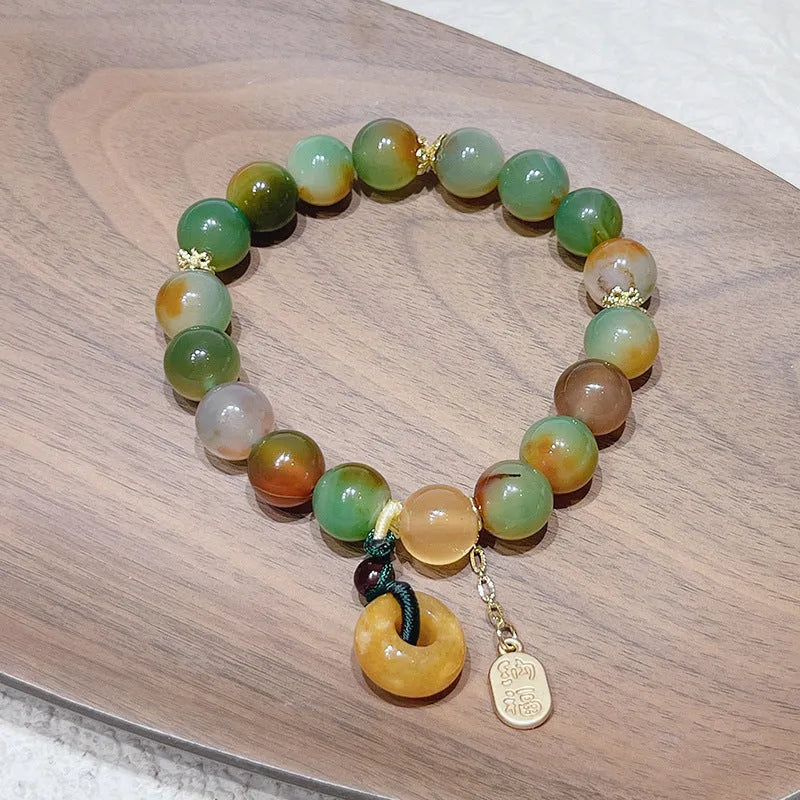 Yellow peacock agate women's bracelet with peace buckle clasp and old mine topaz accents