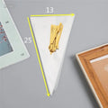 Clear triangle plastic packaging bag with a twisted wire tie closure on a white background.