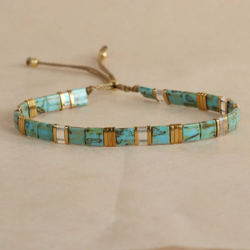 Geometric glass bead bracelet in milky white, black, retro green, light blue, or red colours.
