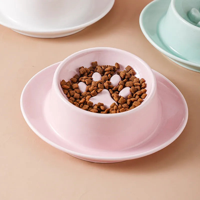 Green ceramic slow feed pet bowl with a central mound and obstacles to prevent fast eating.