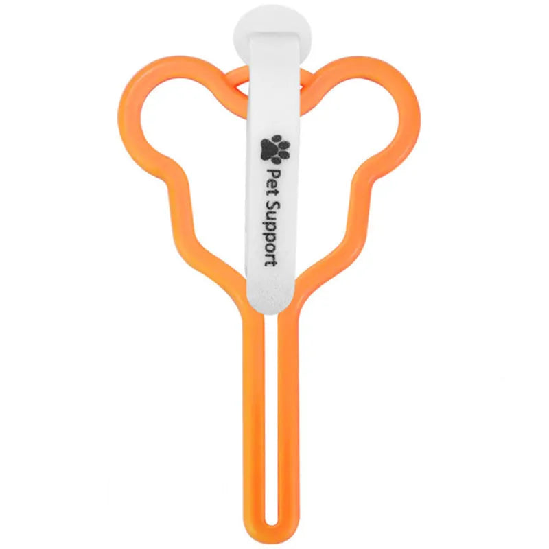 A hands-free dog poop bag holder with a fixed clip and adjustable black Velcro strap attached to a leash.