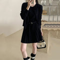 Women's grey art retro knitted vest skirt and long sleeve cardigan two-piece set on a hanger.