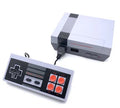 Black NES 8-bit retro game console with two rectangular controllers on a white background.