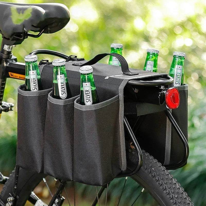 Black double-sided bicycle bag mounted on a bike carrier, showing two compartments.