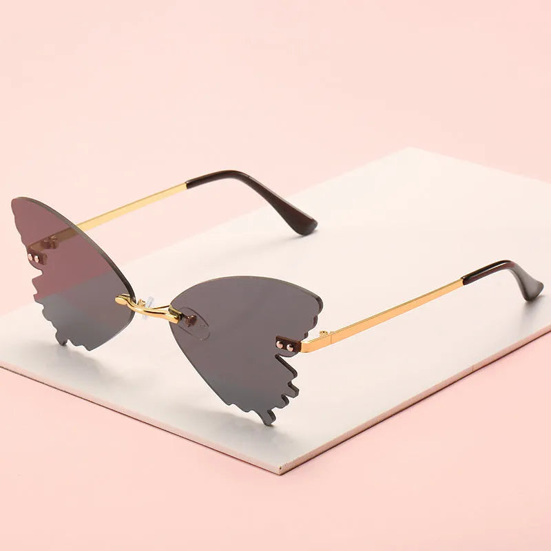 Butterfly rimless sunglasses with UV400 protection in vintage style plastic and metal frame