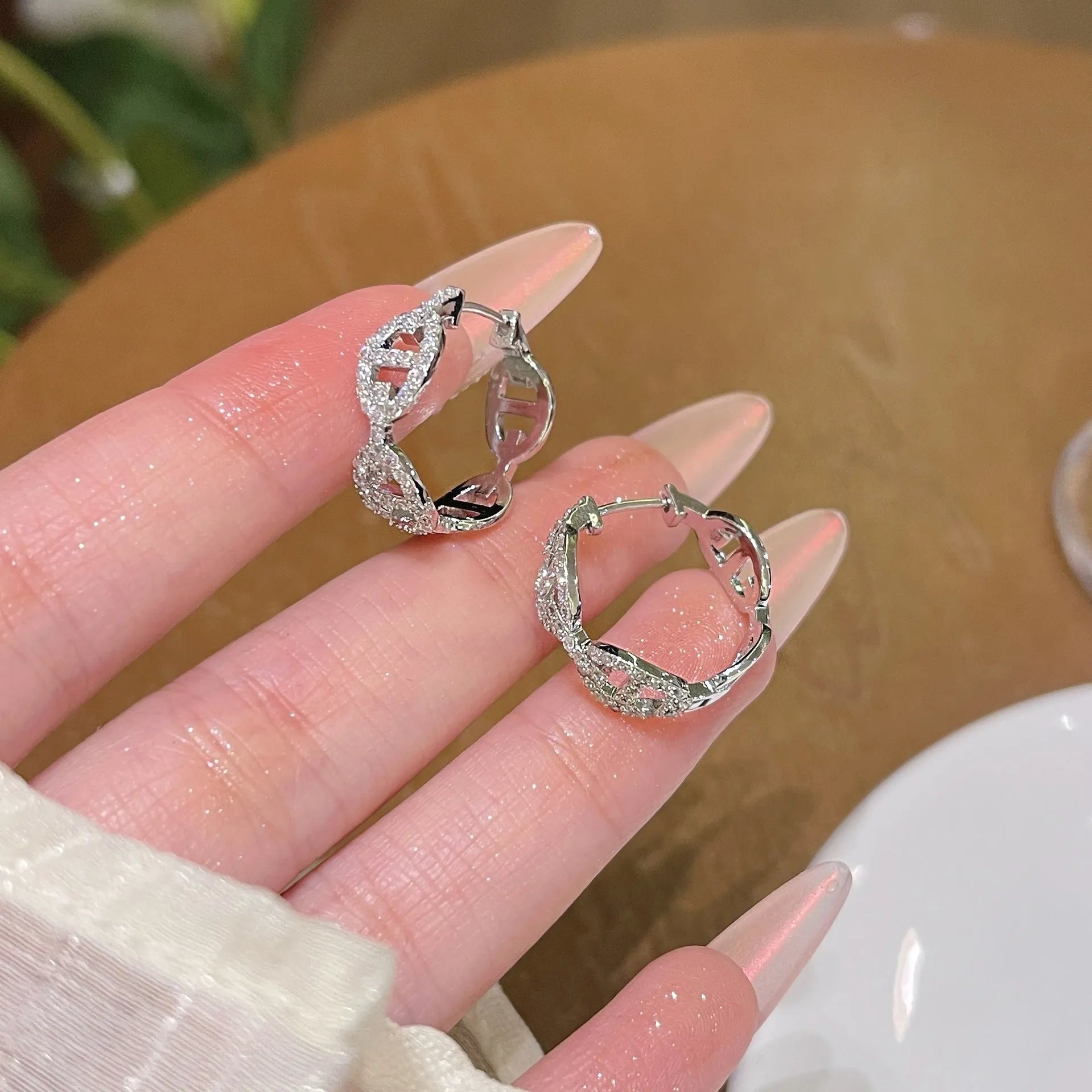 A pair of women's casual earrings with a thick gold-plated finish, shown in silver, gold, and rose gold colour options.