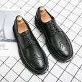 Men's black and brown round toe brogue shoes made from artificial PU leather for business wear.