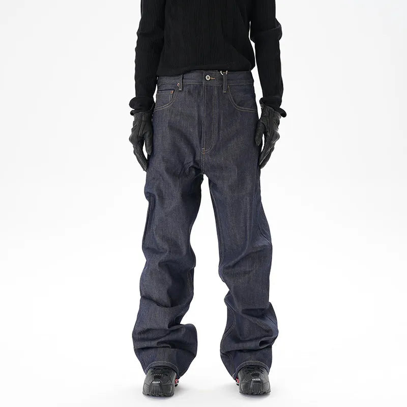 A pair of dark blue loose-fit straight leg jeans on a neutral background.