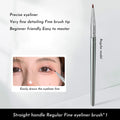 Black bent head eyeliner brush with wooden handle for detail eye makeup application.