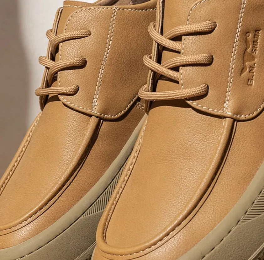 British retro style brown leather casual shoes with big toe design on a white background.