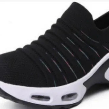 Stretch knitted mesh sock shoe for women in light grey colour with round toe and low heel.