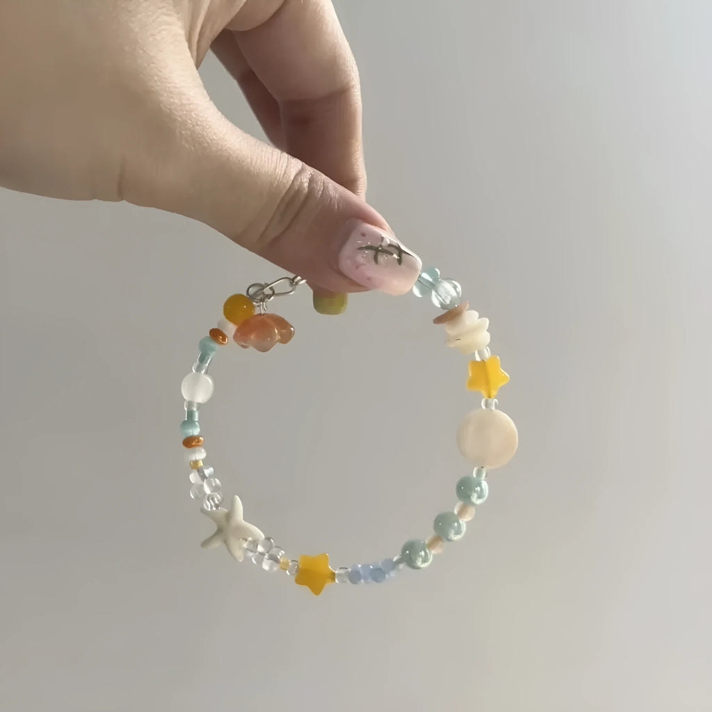 Orange water-soaked alloy bracelet with diamond shape and round elements for summer seaside styling