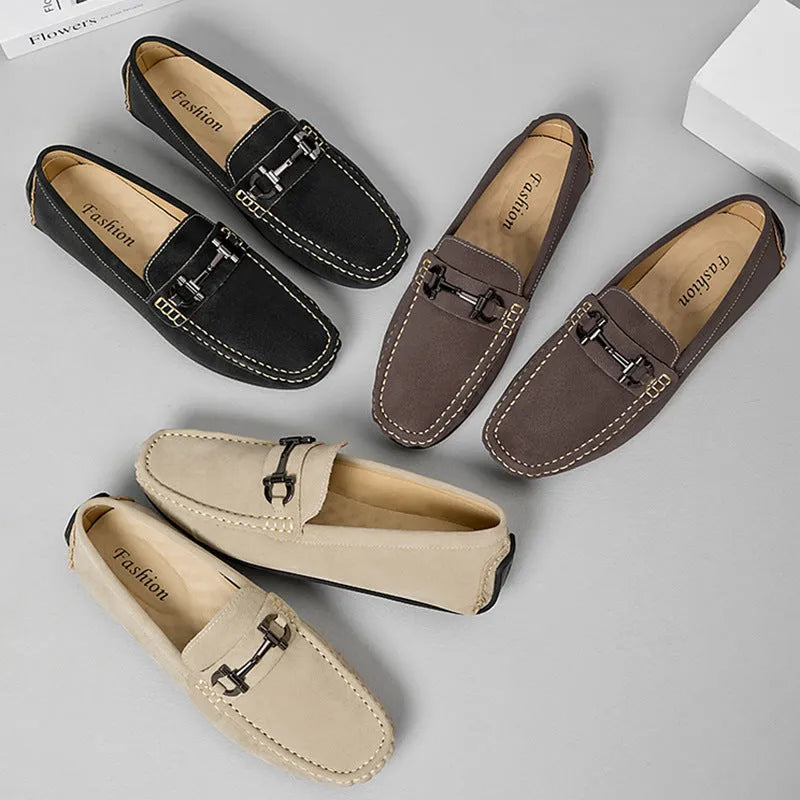 Men's brown leather slip-on loafers with a round toe and rubber sole.
