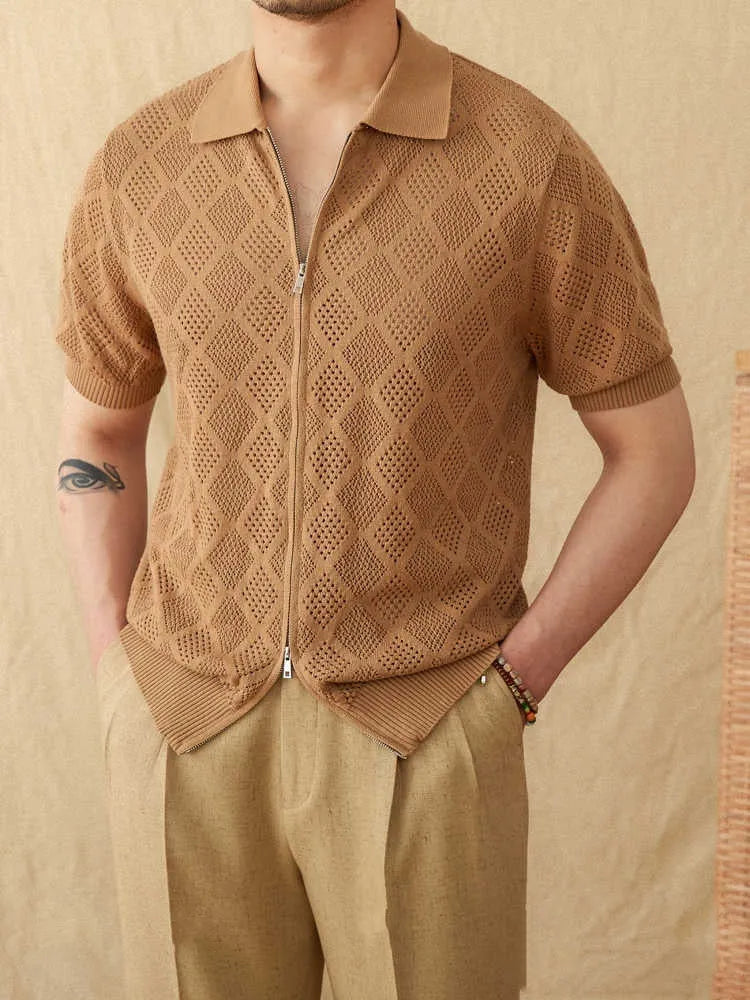 Light brown cotton short sleeve cardigan with front zipper and lapel collar laid flat.