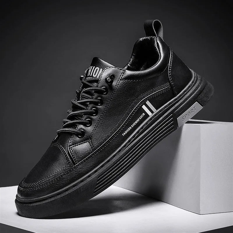 Men's white and black low-top skate shoes with elastic band and round toe.