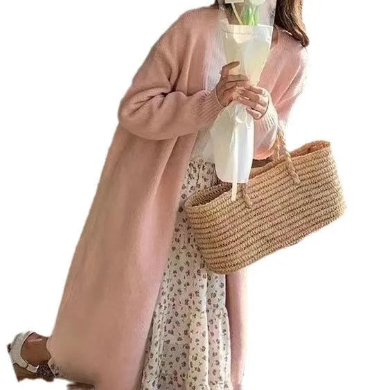 Women's khaki knitted V-neck cardigan with long sleeves, shown on a model.