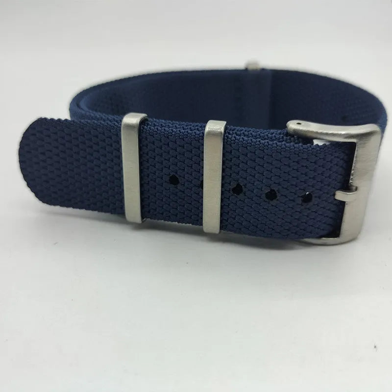 Nylon textile watch strap in army green colour with metal buckle, shown alongside black and blue options.