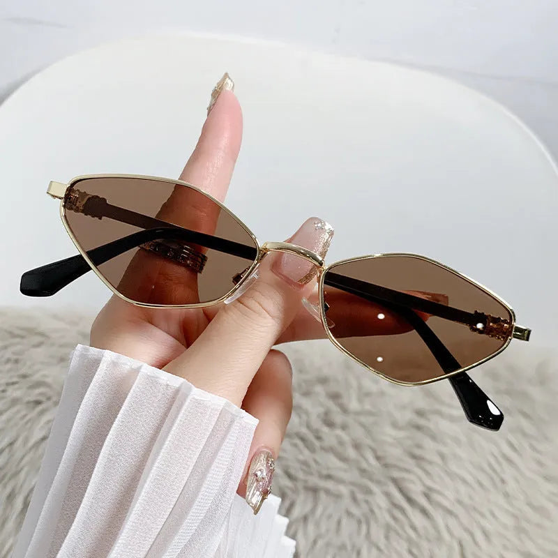 Gold metal small frame rhombus cat eye sunglasses with coloured lenses.