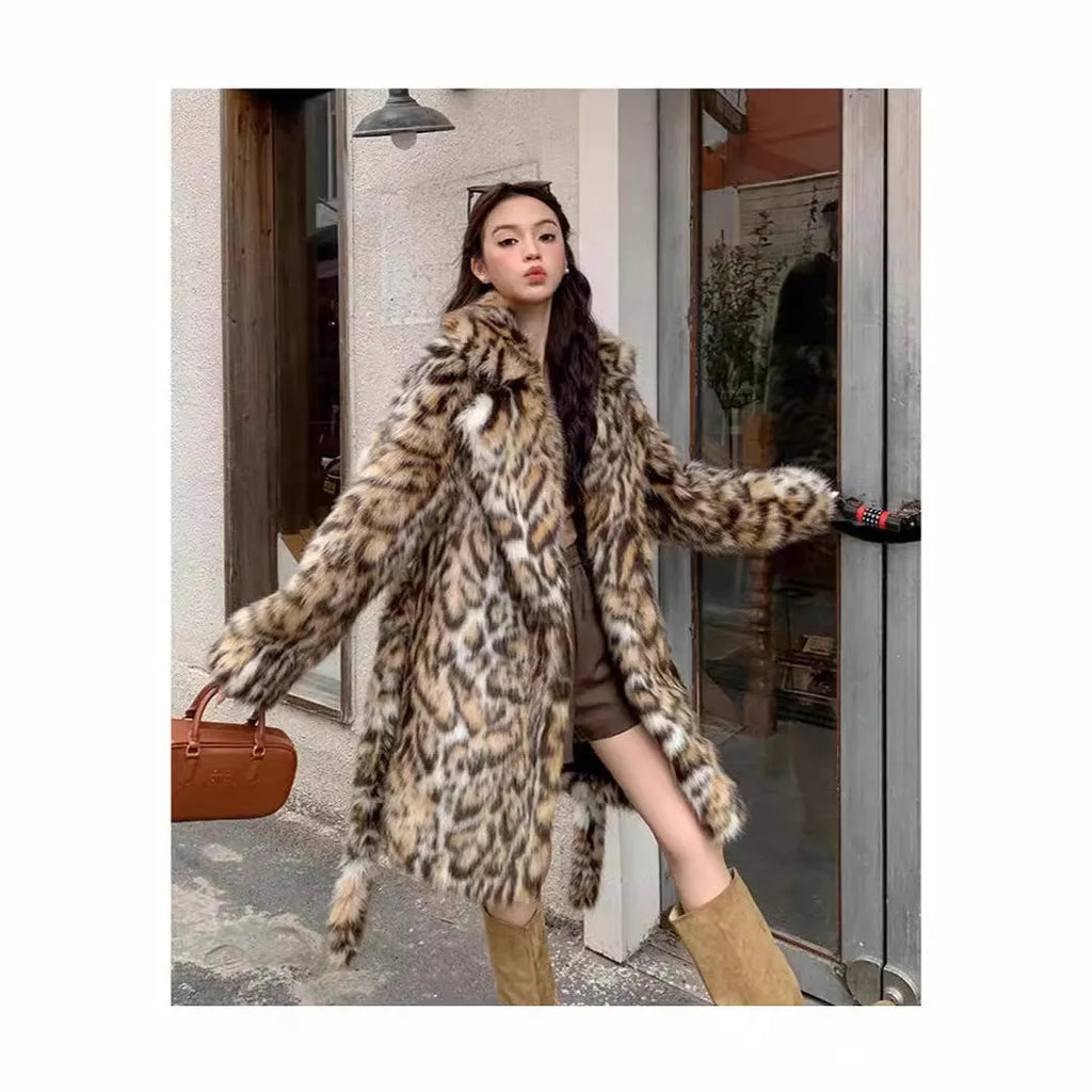Faux fur coat with detachable collar in street fashion style showing long length and practical pockets