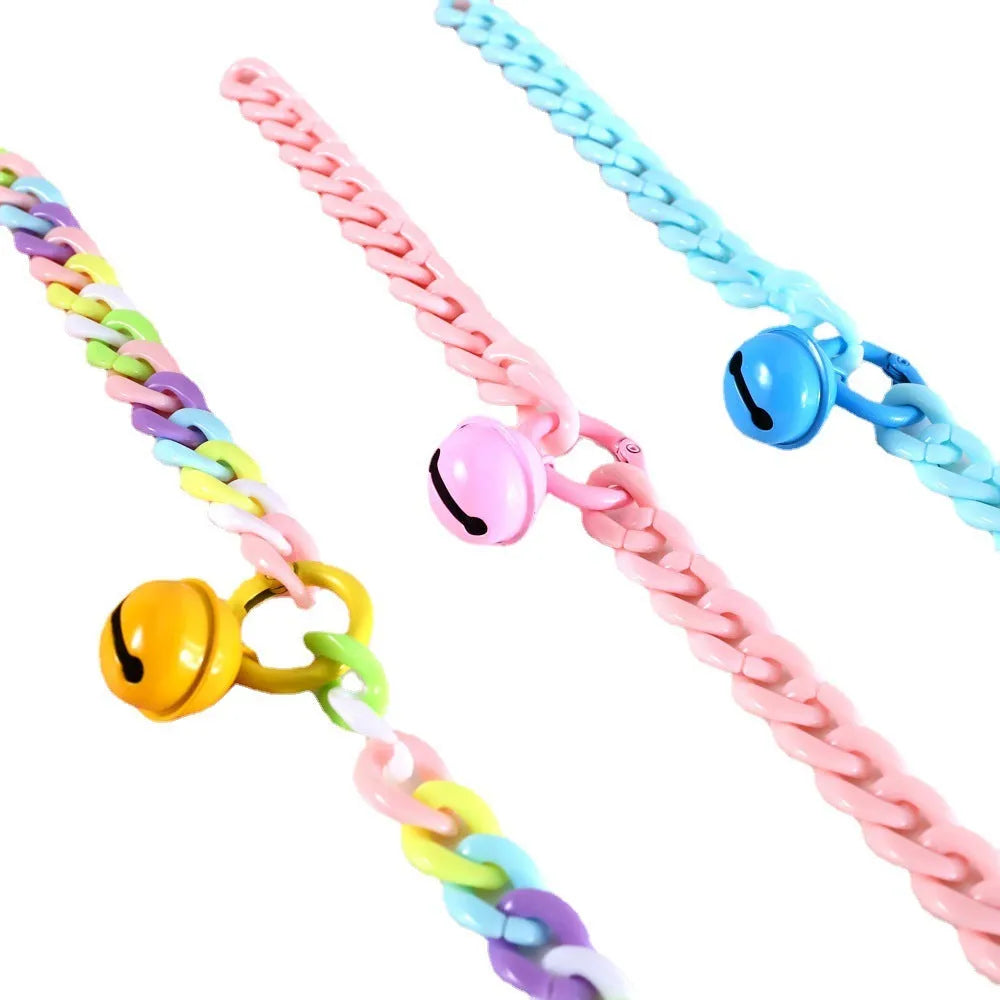 Macaron candy colour plastic collar for pet dog cat rabbit on a blue background.