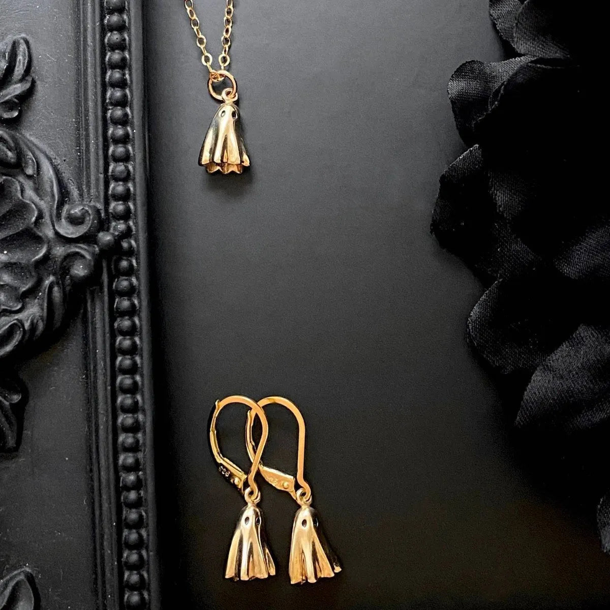Ghost pendant necklace with titanium steel pendant on a stainless steel chain, showing chain style options.