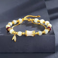 Bamboo bracelet with glass flower charm and Ruyi pattern in beige, green, light green, or white