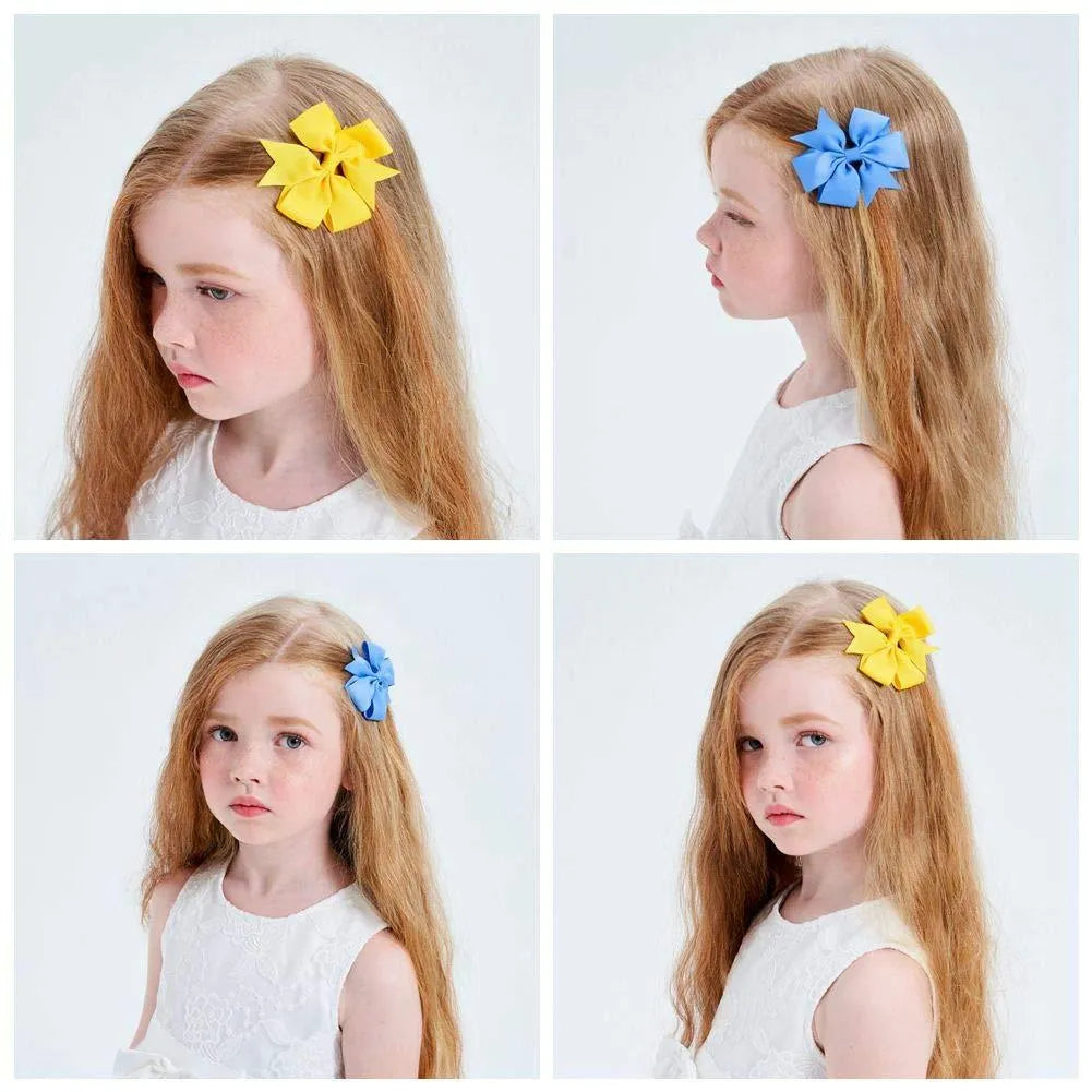 20 pairs of multicoloured 3-inch grosgrain ribbon pinwheel hair bows with alligator clips for baby girls.