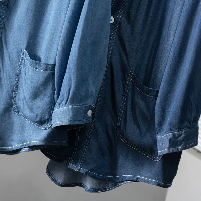 Men's dark blue casual denim coat with V-neck collar and chest pocket on a hanger.