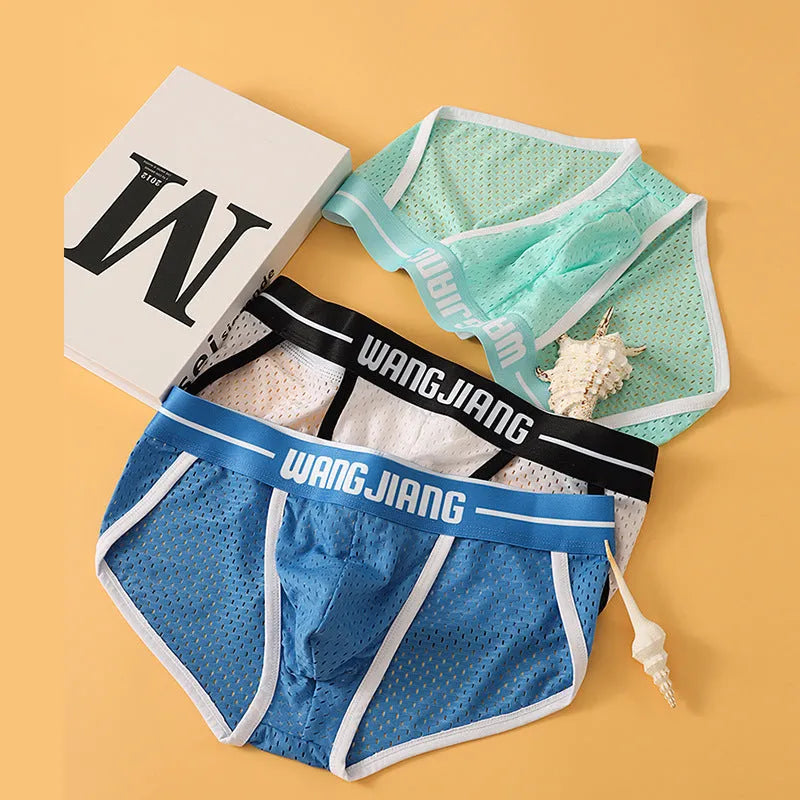 Men's black Ice Silk mesh triangle underwear briefs laid flat, showing solid colour and fabric texture.