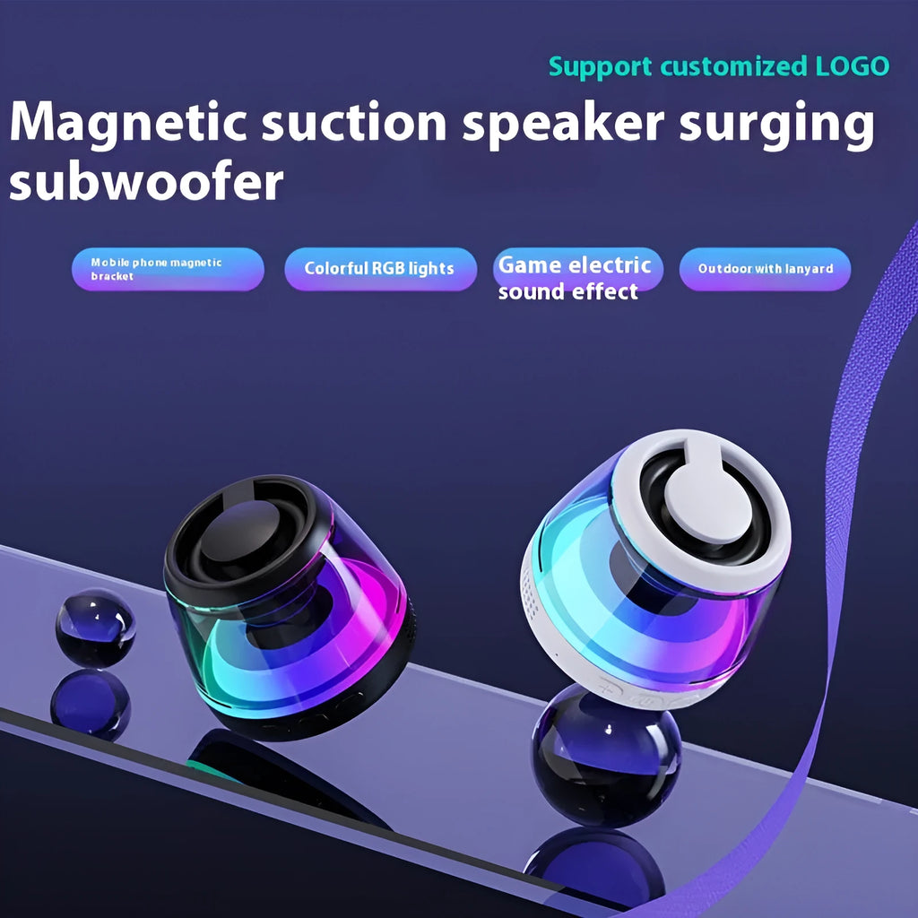 Small portable black Bluetooth speaker with coloured ambient light, shown with a magnetic base.