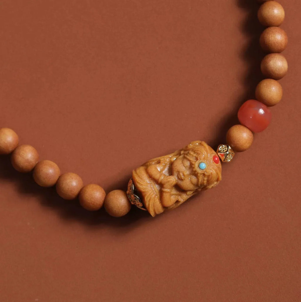 Brown wooden bracelet with sandalwood beads featuring South Red Zachilam and double circle design