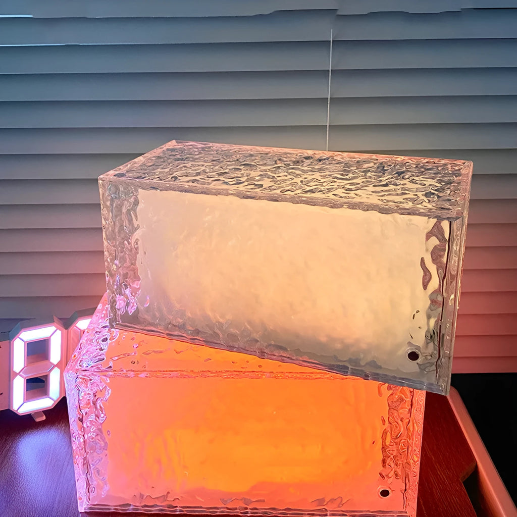 Geometric clear acrylic night lamp showing multi-colour LED illumination.