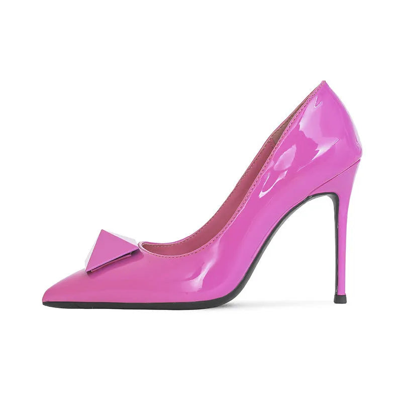 Pink patent leather women's stiletto heels with pointed toe, rivet details, and a buckle ankle strap.