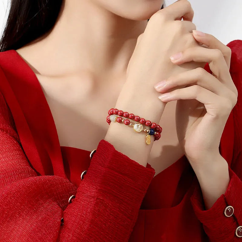 S925 sterling silver bracelet with white shell, red cinnabar, and purple gold sandstone beads and a blessing card charm.