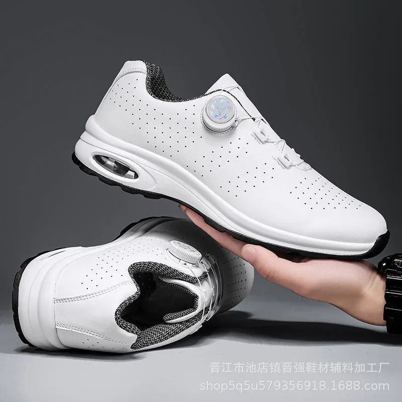 Low-top black and white mesh tennis shoes with cross-strap design and flat composite sole