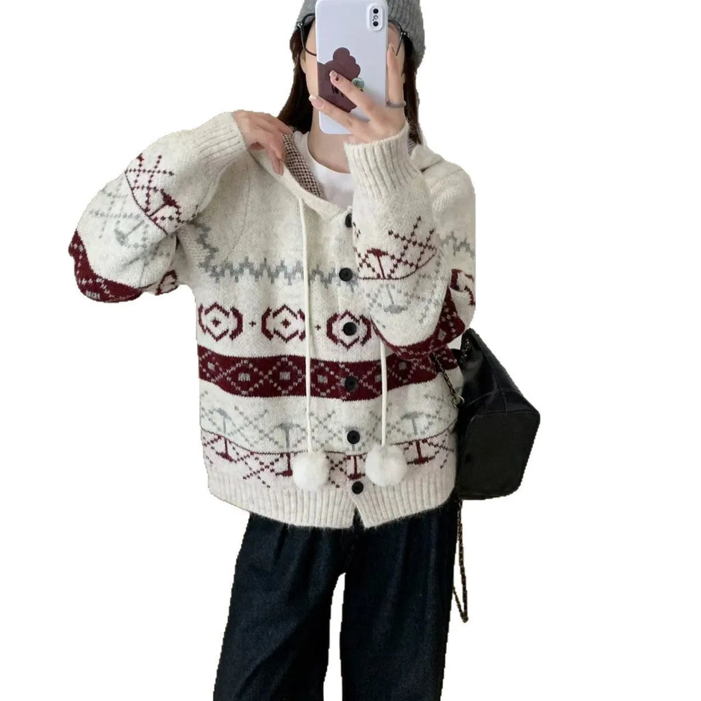 Loose grey brocade sweater coat with geometric pattern on a plus-size model.