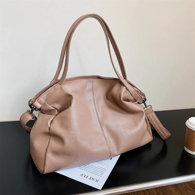 Large soft-surface PU messenger tote bag in black with zipper opening and adjustable shoulder strap