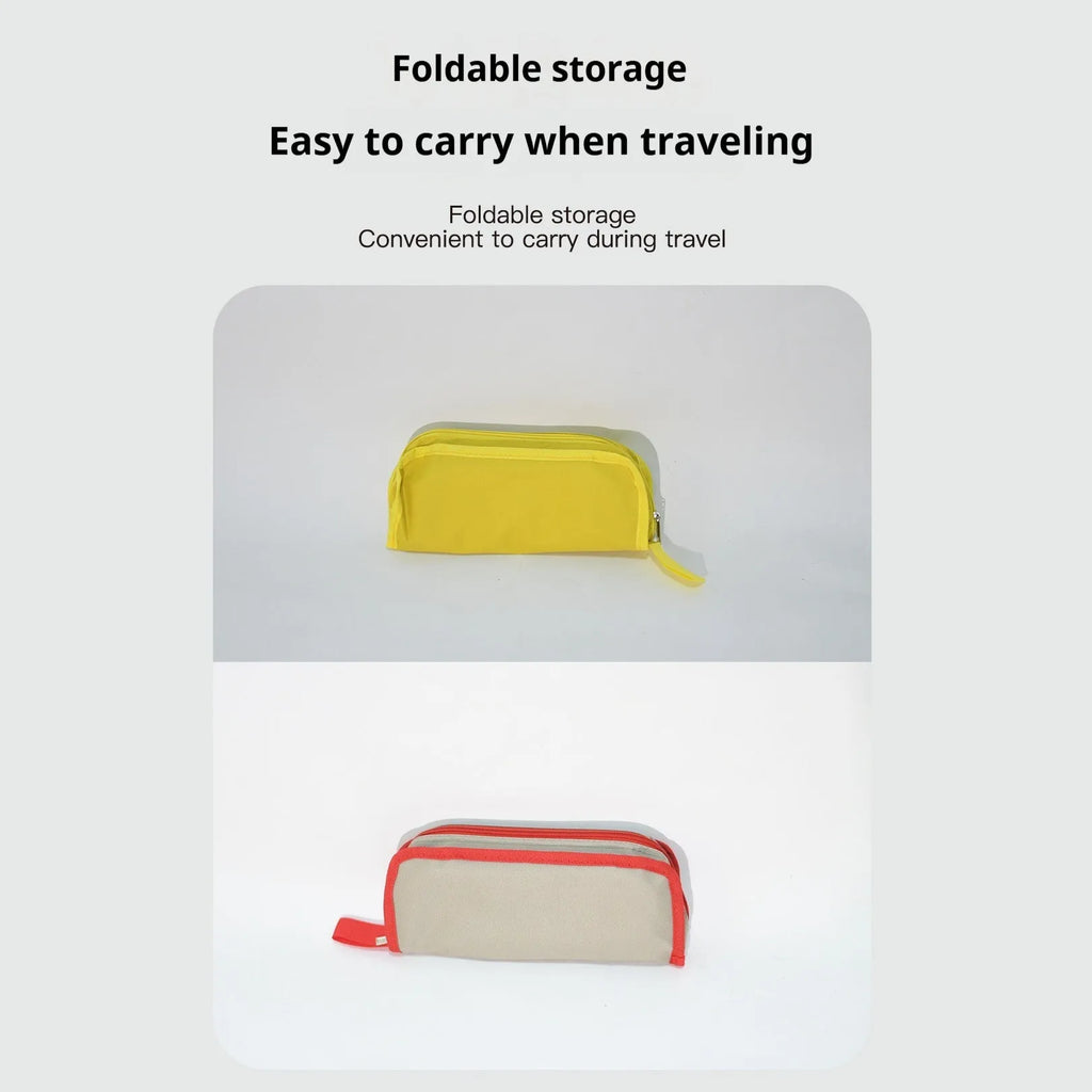 A foldable outdoor camping stool in Oxford cloth, shown in a khaki colour, folded compactly.